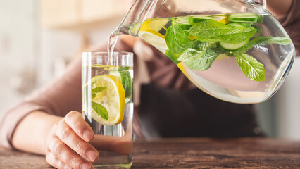 Detox water with lemon, cucumber and mint leaves