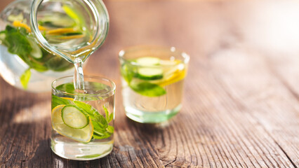 Detox water with lemon, cucumber and mint leaves	