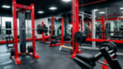 Fototapeta premium Abstract blurred fitness center with equipment as background, modern theme with complete equipment, bright light, blurred gym background.