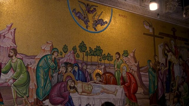 people pray in the Church of the Holy Sepulchre in Jerusalem