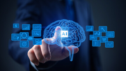 Artificial intelligence, technology, and business innovation concept with digital brain and AI circuit glowing in hand of businessman.
