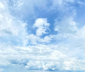 Beautiful captures a bright blue sky, fluffy clouds, creating a peaceful atmosphere. perfect for use as a background, or creative design element in posters, inspirational graphics, or digital projects