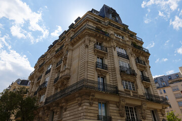 Traditional French house with typical balconies and windows. Paris, France.