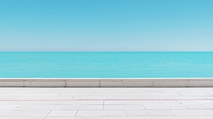Fototapeta premium A serene beach scene with a calm ocean and clear blue sky.
