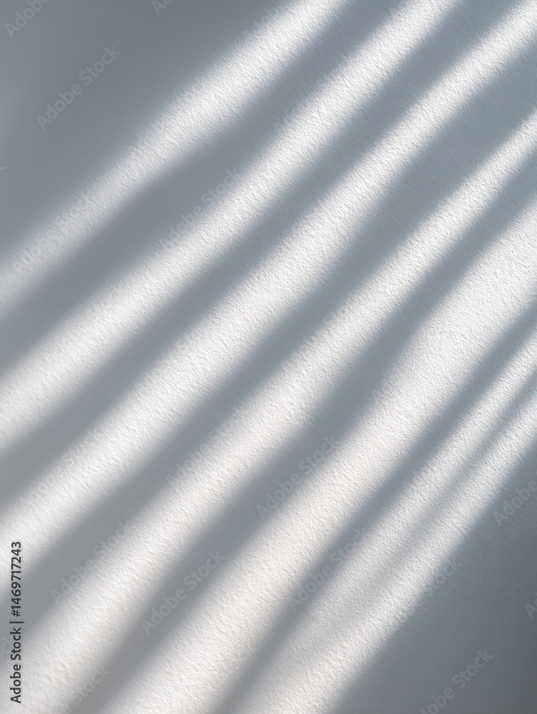 Poster soft shadows dancing across a smooth white surface creating a serene and calming atmosphere