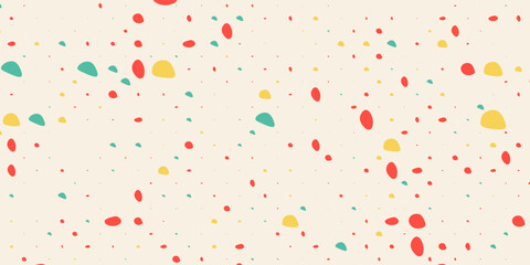 Abstract chaotic seamless pattern with colorful hand drawn polka dots on a beige background for fabric, wallpaper.
