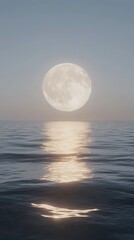 Large moon is reflected in the water of the ocean. The sky is clear