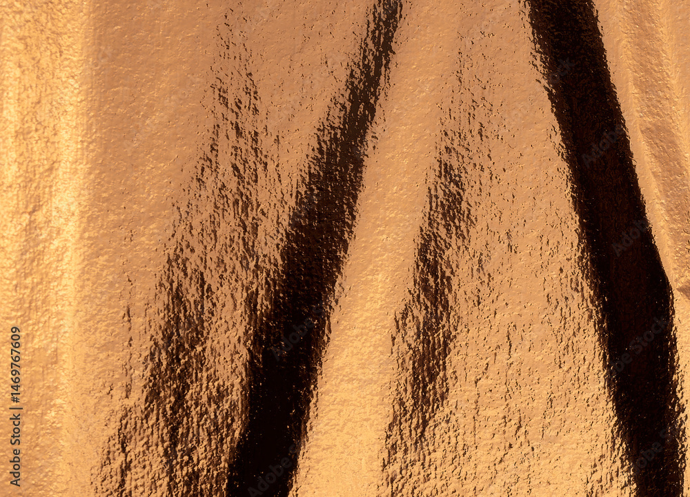 Poster Golden and bronze foil texture with a glossy, shiny finish, creating a sleek, luxurious backdrop.
