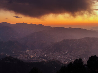 City in The Mountains at Sunset