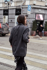 Street style fashion, professional model in stylish clothes.