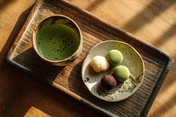 Matcha Green Tea with Japanese Sweets on a Wooden Tray in Soft Afternoon Light