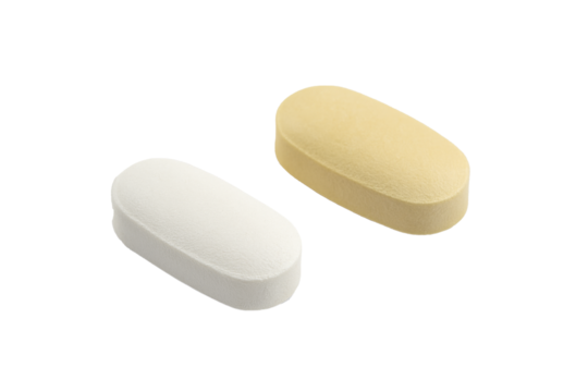 Two Pills: A closeup photo showcasing two pills, one white and one yellow, isolated against a plain background. Both are oval shaped and ready to be used for pharmaceutical branding, product design.