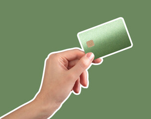 Hand holding a green bank card with chip, symbolizing luxury and secure cashless transactions.