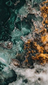 Stunning macro view of emerald green and gold marble, perfect for a modern wallpaper.