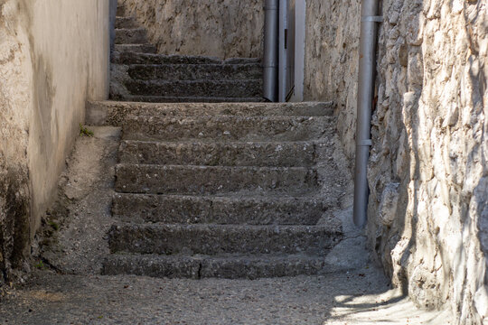 Ancient Stone Stairs Between Rustic Buildings