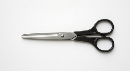 Obraz premium Black Handled Scissors on White Background