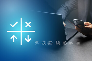 A businessman working on laptop with SWOT analysis concept