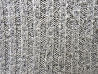 Winter beige knitting fabric background