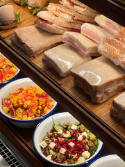 Variety of Sandwiches and Salads Displayed Delicious assortment ready for purchase in a cafe Bakery