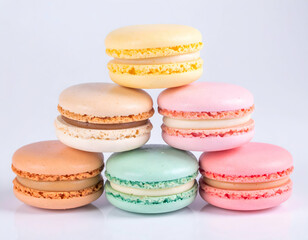Fototapeta premium Colorful Stacked Macarons On White Background