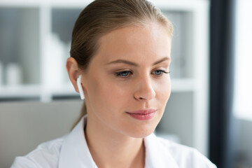 Fototapeta premium Young and professional female doctor working in a medical office. Health care and medicine concept.