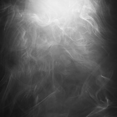 Abstract smoke texture over black background. Fog in the darkness.