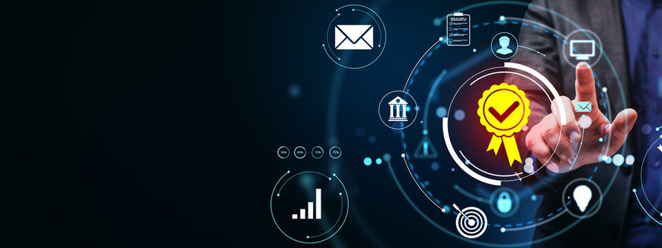 Businessman interacting with digital quality assurance certification icon on futuristic abstract light background with technology elements.