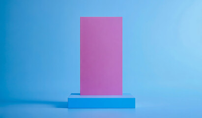Minimalist composition featuring pink rectangular form and blue geometric shapes on a blue backdrop