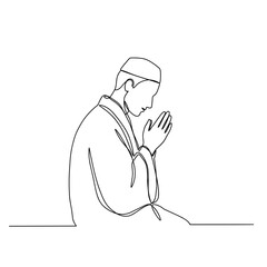 Silhouette of a person praying in a humble position during prayer  