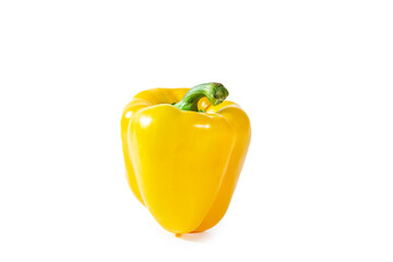 Fresh juicy shiny yellow bell pepper isolated on white background.