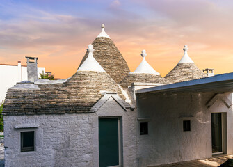 beautiful touristic view of white mediterranean buildings in old medieval Italian style of trulli...