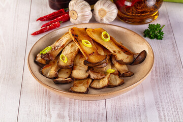 Roasted eringi mushrooms in the plate
