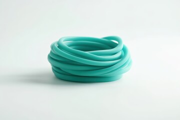 Naklejka premium Teal rubber bands in a nest