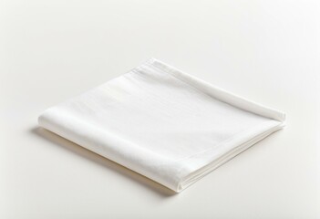 A folded white napkin on a white surface.