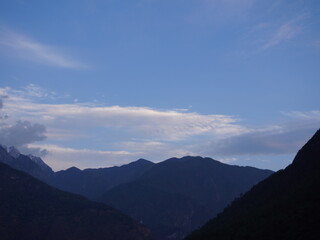 Fototapeta premium Ranges of mountain during blue hour