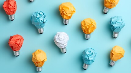 Colorful Crumpled Paper Lightbulbs on Blue Background