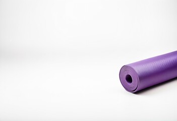 A rolled up yoga mat on a white background.
