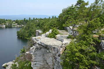 Minnewaska State Park Preserve on Shawangunk Ridge in Ulster County, New York. Lake Minnewaska Cliffs on foggy cloudy day