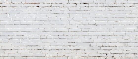 Obraz premium A neutral toned weathered brick wall with a consistent geometric pattern creating a striking architectural backdrop