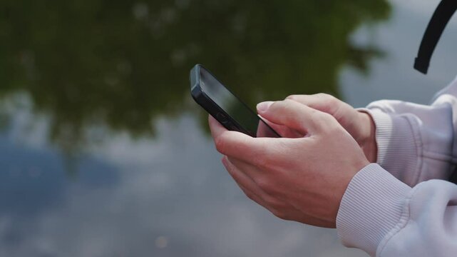A man is texting on the phone.
Communication and communication using a mobile phone.
Close-up of a smartphone in hands.
Phone, smartphone, gadget, correspondence