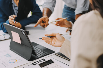 Team of financial advisory services. Asian advisor showing plan of investment to clients in the consultancy office..