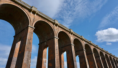 Fototapeta premium famous Ouse valley viaduct in England at sunny day with blue sky