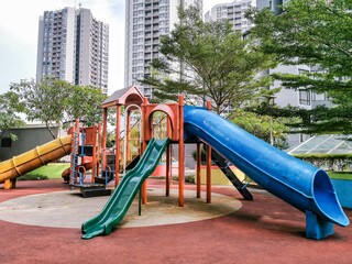 playground in the park. Colorful Playground in Urban Apartment Complex, Family-Friendly Outdoor...