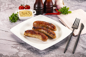 Delicous natural roasted sausages in the plate