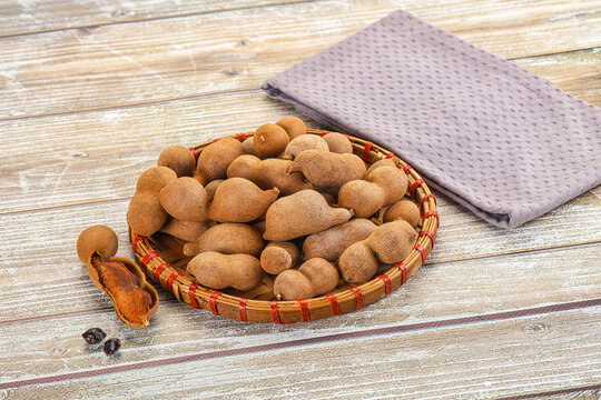 Tropical exotic Tamarind fruit heap