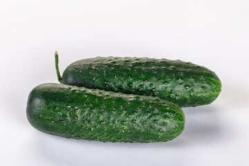 Ripe green raw two cucumbers