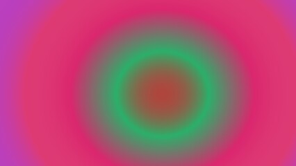 Concentric circles of vibrant, blurred hues; pink, purple, green, and red gradients create a mesmerizing optical effect