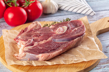 Raw lamb steak with bone
