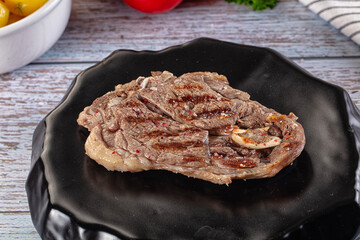 Grilled lamb steak with bone
