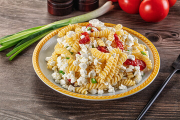 Italian pasta fusili with curd